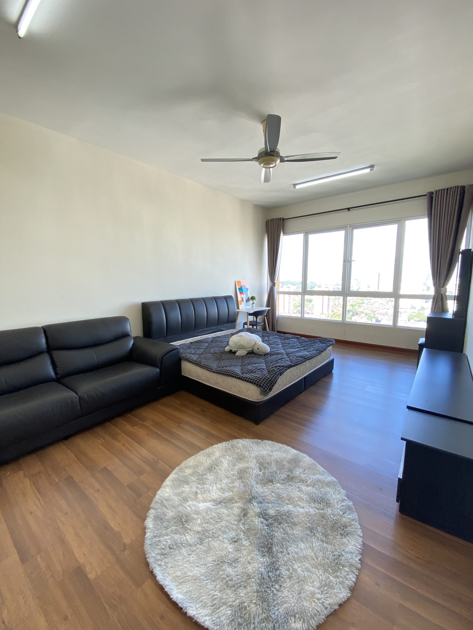 Spacious premium master room in Jelutong – furnished with sofa, bed, and wardrobe
