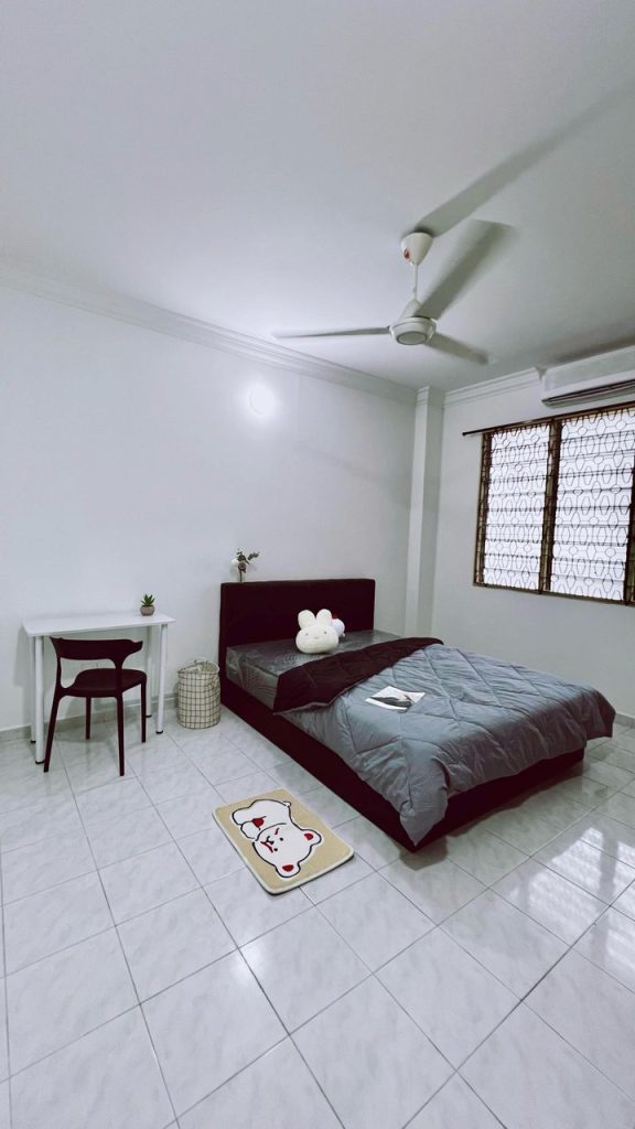 Furnished medium room in Gelugor – includes bed, study table, and wardrobe